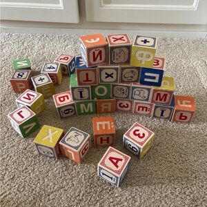 Russian/english language wood play blocks. In good used condition.